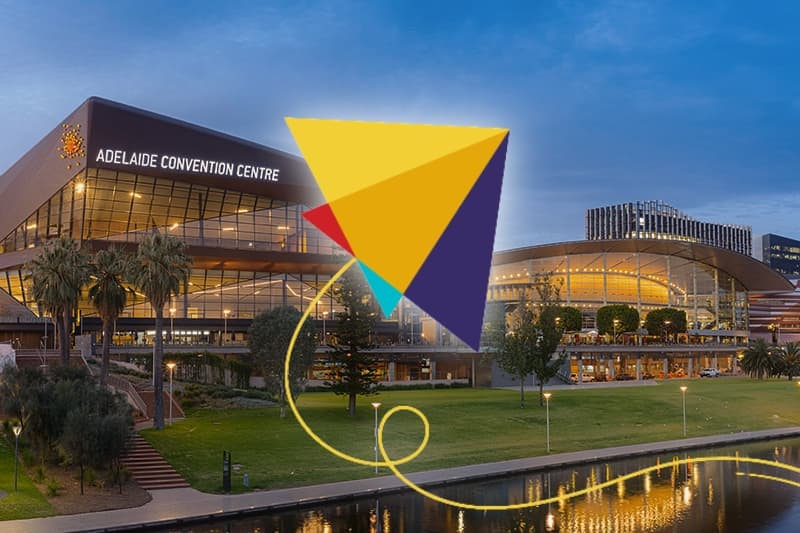 Conference logo super-imposed on a photo of the Adelaide Convention Centre