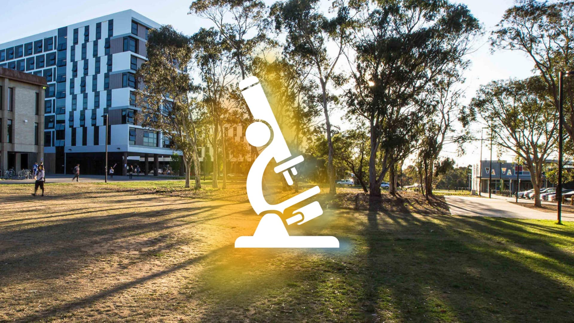 The researchED logo super-imposed over a photo of the University of Canberra campus at dusk